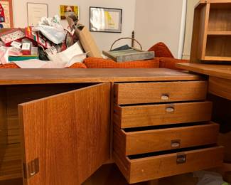 The "Corona" sideboard in teak with rosewood handles