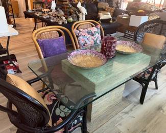 Glass top dining table with Rattan casual chairs