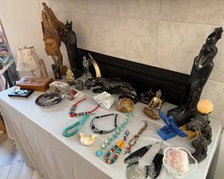 Carved wood and stone statues, jewelry 