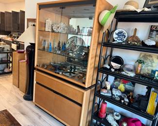 A mirrored class act cabinet with lots of room for dining room items and your fine collectibles