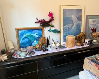 Black lacquered dressers, a little worn, and great artwork, stones, rocks etc.