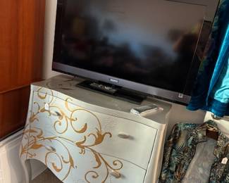 Sony Bravia TV and ornate dresser