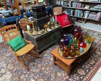 Family Room 
Canned rocking chairs
Early trunk
Brass candlesticks
MCM glass