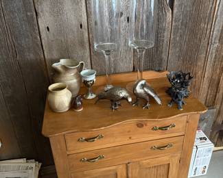Family Room 
Commode
Pottery
Metal birds