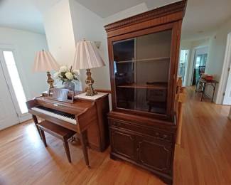 Smaller size upright piano, left front leg needs repair, the china cabinet is fabulous, the clear glass really showcases the contents, it’s a sweet size too