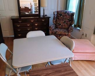 Room full of misc furnishings, a matching tall and low dresser, full size bed, and more 