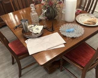 Wooden dining table with leaf expansions, and four chairs