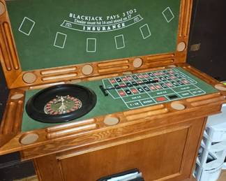 Large 3 piece gaming cabinet has roulette table, Black jack table and caps table