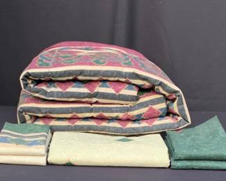 Comforter, bed skirt, fitted/flat sheets, two pillow cases, two shams for a double size bed.