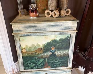 Painted wood cabinet with brass decor