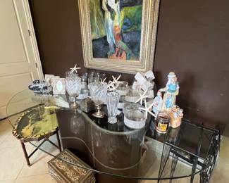 Lots of crystal and glass vases and candlesticks