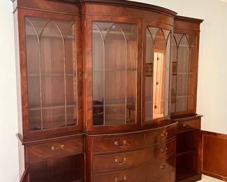 Pre-Sell Price $1875...Traditional Breakfront China Cabinet...Arched mullioned glass doors with wood fretwork, bowed front with five drawers, crown molding, and dentil trim along the top. Purchased at Englishman's Fine Furnishings in 2006 for $7000. 94w x 20d x 86h