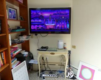 Books, bric-a-brac, TV, writing desk