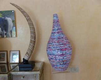 Pair of mirrored cabinets, bric-a-brac, framed African animal photographs, lucite pedestal, rolled paper vase