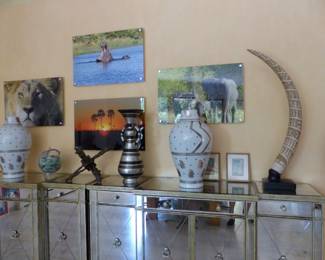 Pair of mirrored cabinets, bric-a-brac, framed African animal photographs