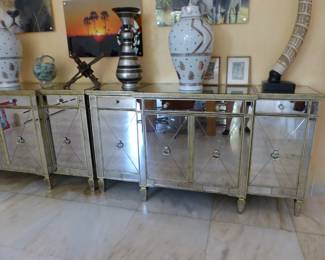 Pair of mirrored cabinets, bric-a-brac, framed African animal photographs