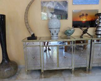 Pair of mirrored cabinets, bric-a-brac, framed African animal photographs