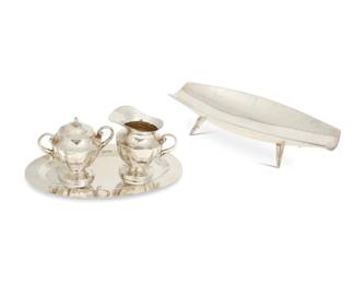 292
Mid-20th century
A group of Mexican sterling silver table items
Sugar and creamer marked: JLR / Sterling / .925 / Made in Mexico [Eagle 9] / 24; tray and bowl marked: CLS / Sterling .925 / Hecho en Mexico; tray further marked: [Eagle 141]; bowl further marked: [Eagle1]
Comprising a Juventino Lopez Reyes cream jug and covered sugar, and a CLS oval tray and navette-form footed bowl
4 pieces
Bowl: 2.5" H x 12" W x 5" D; Creamer: 4" H x 4.25" W x 2.875" D
30.2 oz. troy approximately
Estimate: $300 - $500