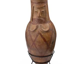 148
Circa 900 CE or 1200-1400 CE; Narino-Carchi, Colombia/Ecuador
A Pre-Columbian Capulí pottery effigy urn
The ceramic bullet-form urn with flared rim, incised bust in relief to one side, and polychrome geometric motifs to body, set in a metal stand
Urn: 21.5" H x 8" Dia. approximately; Stand: 6.5" H x 7.375" Dia.
Estimate: $300 - $500