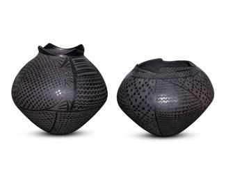 136
Imelda Quezada (b. 20th century)
Two Mata Ortiz blackware pottery jars, early 21st century; Chihuahua, Mexico
Each incised to underside: Imelda Quezada
The black on black jars. each with quadrillos pattern and geoetric motifs throughout, below a stylized rim
2 pieces
Taller: 7.625" H x 7.375" Dia.; Shorter: 6.375" H x 7.875" Dia.
Estimate: $200 - $300