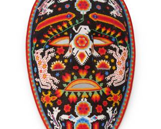 306
Early 21st century
A Mexican Huichol beaded mask
Signed and inscribed verso: Nicolaza Bautista / [various ciphers] / Centro Huichol
The carved wood mask with polychrome beadwork designs depicting various figures and foliate motifs
13.75" H x 8.25" W x 3.25" D
Estimate: $200 - $300