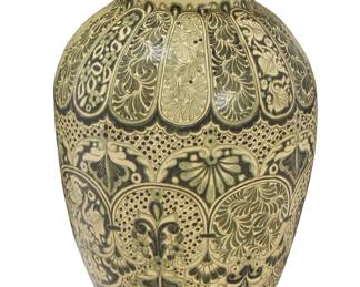 225
20th century; Puebla, Mexico
A Mexican Talavera pottery garden urn
The urn adorned with floral and foliate motifs in shades of green glaze
26.75" H x 19.75" Dia.
Estimate: $300 - $500
