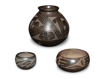 364
A group of Mata Ortiz pottery vessels
Mid-20th century; Chihuahua, Mexico
Three works:

Santanita Suazo (1925-2005)
A small blackware bowl
Signed: Santanita Suazo / [illegible]
The bowl with black on black banded geometric motifs below rim
2.5" H x 3.625" Dia.

Joel Silveira (b. 20th century)
A blackware pottery vase
Incised to underside: Joel
The round-bottom vase with flared rim and black on black geometric motifs
7.125" H x 7" Dia.

A blackware pottery bowl
Unmarked
The bowl with black on black banded feather and geometric motifs
3.25" H x 6.125" Dia.

3 pieces
Estimate: $100 - $200