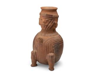 268
Circa 100 CE; Ecuador
A Pre-Columbian pottery effigy vessel
The possibly Panzaleo ceramic figural vessel, depicted seated and holding a small cup, with incised facial features and polychrome stripes to left side of face and body
14.25" H x 8" W x 8" D
Estimate: $400 - $600