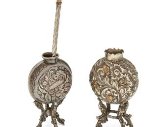 269
Early/mid-20th century
Two Latin American yerba mate vessels and bombilla straw
Bombilla marked: Industria Mamboreta Argentina
Comprising an alpaca silver vessel with chased and repoussé floral and foliate motifs, raised on figurative mask-form legs, a silver alloy vessel with chased and repoussé floral and avian motifs, raised on foliate-form legs, and an alpaca silver bombilla straw
3 pieces
Taller vessel: 5.5" H x 3.25" W x 2.125" D; Straw: 7.5" L
Estimate: $200 - $400