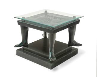 115
Sergio Bustamante
b. 1949, Mexican
"Small table with Face," 1996
Patinated cast bronze with glass top on painted wood plinth
Edition: AP
Signed in the casting: Sergio Bustamante ©
Bronze: 16.5" H x 27.5" W x 27.5" D; Glass: 25.75" W x 25.75" D; Plinth: 5.5" H x 24.5" W x 24.5" D
Estimate: $1,000 - $1,500