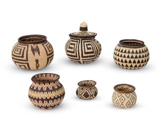 222
Late 20th/early 21st century; Darién Province, Panama
A group of Panamanian Wounaan basketry vessels
The coiled baskets woven from palm frond fibers, each depicting various geometric motifs, the largest depicting a butterfly figure, one with a bird-form finial to lid
6 pieces
Largest: 5.25" H x 7.375" Dia.; Smallest: 2.375" H x 3.375" Dia.
Estimate: $500 - $700