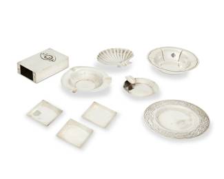 331
Mid-20th century
A group of Mexican silver items
Variously marked for maker, for sterling, and for Mexico
Comprising three sterling silver ashtrays including two round trays and a shell-form footed tray, each by various makers including Juventino Lopez Reyes, and Maciel, as well as three diminutive Maciel diamond-shaped sterling silver dishes, a large chased silver dish, an Emma/Pasaje Alameda small shaped sterling silver bowl, and a Bernice Goodspeed sterling silver box/holder sleeve
9 pieces
Largest ashtray: 4" Dia.; Largest dish: 4.5" Dia.; Box/cover: 3.5" H x 2.25" W x 1" D
12.020 oz. troy approximately
Estimate: $200 - $400