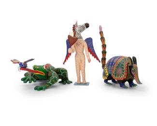 311
Late 20th/early 21st century; Oaxaca, Mexico
Three Mexican alebrijes figures
Frog signed and inscribed to underside: Amelia, Morales, Arrazola, Oax, Mex; armadillo signed: Jacinto Mandarin / Arrazola Oaxaca; zebra signed: Coindo Melchor Gómez / Oaxaca México; zebra with applied sticker: Hecho en Mexico
The vibrantly painted folk art figures carved from copal wood, comprising a frog figure depicted catching a butterfly on its tongue, an armadillo figure, and a winged anthropomorphic figure with a zebra head, depicted carrying a sacred heart
3 pieces
Frog: 6.75" H x 17.75" W9.5" D; Armadillo without tail: 6.625" H x 10.5" W x 5.875" D
Estimate: $200 - $400