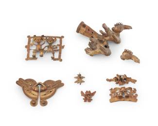276
A group of pre-Columbian-style tumbaga ornaments
Unknown date, Central America
Comprising six stylized figural works in gold-toned mixed metal, each with wire and textured wire overlay accents and designs, including a large bird motif finial or pipe end, as well as five pendants in various styles and sizes including a rectangular pendant with male and female seated figures, a male figure pendant flanked by serpent motifs, a wide double-headed bird motif pendant, and two diminutive figural pendants, 6 pieces
Finial: 2" H x 4.25" W x 4.75" D; Largest pendant: 2.75" H x 4.25" W; Smallest: 1.125" H x 1" W
387.0 grams gross
Estimate: $400 - $600
