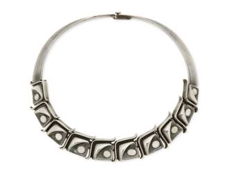 325
An Antonio Pineda Mexican silver and moonstone necklace
Antonio Pineda (1919-2009)
Circa 1953-1979; Taxco, Mexico
With crown mark for Antonio Pineda; further stamped: [Eagle 3] / JCL / 970 / Taxco / Hecho en Mexico
A sterling silver collar necklace featuring ten square stylized links each inset with an oval cabochon moonstone
15" L x 0.875" H
119.3 grams gross
Estimate: $1,500 - $2,000