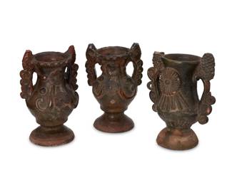 89
Early 20th century; Totonicapan, Guatemala
Three Guatemalan pottery vessels
Possibly sacramental, each footed vessel with opposed sculptural lug handle surmounted by pinecone finials, the front of each body featuring variations of floral medallions in relief
3 pieces
Tallest: 8.25" H x 6.375" W x 3.875" D; Shortest: 8" H x 5.25" W x 4.25" D
Estimate: $100 - $200