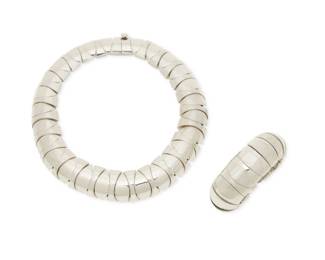 326
A set of Mexican sterling silver jewelry
Late 20th century
Bracelet stamped: Mexico / 925 / TA-62; necklace stamped: 925
Comprising a chunky silver modernist collar necklace with alternating shaped domed links, together with a matching stretch link bracelet, 2 pieces
Necklace: 14" inner C x 1.125" H; Bracelet: 6"-7" inner C (expandable) x 1.125" H
386.0 grams
Estimate: $600 - $800