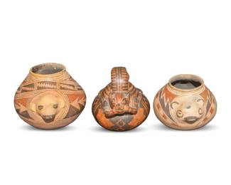363
20th century
Three Latin American pottery effigy vessels
Each with feline-form motifs in relief, comprising two Casas Grandes polychrome jars, each with red and black geometric motifs over a tan slip, and a South American redware vessel with lug handle and black geometric designs
3 pieces
Tallest: 6" H x 8.625" W x 6.75" D; Shortest: 4.875" H x 7" W x 6" D
Estimate: $200 - $400