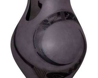 135
Lydia Quezada Celado (b. 20th century)
A Mata Ortiz blackware pottery jar, late 20th/early 21st century; Chihuahua, Mexico
Incised to underside: Lydia Quezada; sticker applied to rim interior: Casas Grandes Pottery / MX / Mata Ortiz, Chihuahua
With a stylized rim, featuring matte black swirling banded geometric motifs a black buff ground
14.5" H x 10" Dia.
Estimate: $400 - $600