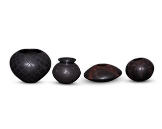 312
A group of Mata Ortiz blackware pottery jars
Late 20th/early 21st century; Chihuahua, Mexico
Four works:
Antonio Dominguez (b. 20th century)
Two blackware seed jars
Each incised to underside: Antonio Dominguez
Comprising a low seed jar with red geometric motifs on a gunmetal buff ground, and another seed jar with black geometric motifs on a gunmetal buff ground
2 pieces
Taller: 3.5" H x 3.75" Dia.; Shorter: 2.625" H x 5.625" Dia.
Jose M. Martinez (b. 20th century)
A blackware jar
Incised to underside: Jose M Martinez
The jar with black banded feather motifs above a checkered pattern to body on a black buff ground
3.625" H x 4.125" Dia.
A blackware wide jar
Incised to underside: Fernando R
The jar with black checkered diamond motif on a black buff ground
5.125" H x 6.25" Dia.
4 pieces total
Estimate: $200 - $400