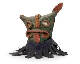 215
Late 19th/early 20th century; Zitala, Guerrero
A Mexican Guerrero tigre mask
The polychrome leather mask with deep set mirror eyes and a fabric neck, used on the feast day of the Holy Cross
12.5" H x 14.5" W x 10" D
Estimate: $500 - $700