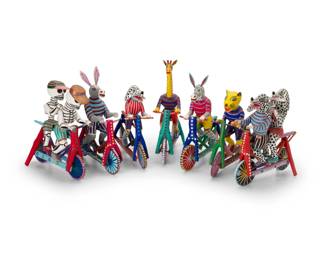 317
Late 20th/early 21st century; Oaxaca, Mexico
A group of Martín Melchor Ángeles alebrijes bicycle figures
Each signed and marked: Martin Melchor Angeles / San Martín Tilcajete / Oaxaca / Mexico; two with applied sticker: Hecho en Mexico
The vibrantly painted folk art figures carved from copal wood, depicting various animal figures including a zebra, a giraffe, a jaguar, three Dalmatians, and two skeletons, each riding a bicycle with articulated wheels
7 pieces
Tallest: 11.75" H x 9.75" W x 3.5" D
Estimate: $400 - $600