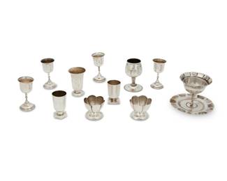 330
Mid-20th century
A group of Mexican silver table items
Variously marked for maker, for sterling, and for Mexico
Eleven works comprising a sterling silver Maciel brazier with incised figural and abstract motifs, together with two sterling silver salt cellars or egg cups, as well as a set of four diminutive sterling silver liqueur goblets, one small single sterling silver goblet, and three sterling silver "jiggers" or shot cups in various shapes
11 pieces
Brazier: 2.75" H x 4" Dia.; Largest cup: 3" H x 2" Dia.; Smallest: 1.5" H x 1.875" Dia.
10.77 oz. troy approximately
Estimate: $300 - $500