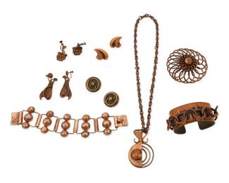 357
A group of mixed metal jewelry
Mid/late 20th century
Variously marked for maker
Eight works comprising a Rebajes copper and mixed metal pendant necklace with a detachable Rebajes copper chain, as well as a pair of Rebajes copper swirl earrings, together with a Pedro Pujol modernist style copper cuff bracelet with attached interlocking rings, a copper-toned metal link bracelet, a copper wire stylized floral openwork pendant, and three further pairs of copper and mixed metal abstract and figural earrings, 13 pieces
Pendant necklace: 18.5" L x 2.25" H; Cuff: 6.5" inner C x 1.125" H; Link: 7" L x 1.5" H; Pendant: 2.5" Dia.; Earrings: 1.75" H to 1" H
220.1 grams gross
Estimate: $200 - $400