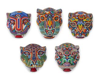 304
Late 20th/early 21st century, Huichol people; Mexico
A group of Huichol beaded jaguar masks
The carved wood masks adorned with polychrome beadwork depicting various flora, fauna, and banded geometric motifs, each set in a custom acrylic case
5 pieces
Largest mask: 10.5" H x 8.5" W x 7.5" D approx.; Each case: 14.125" H x 14" W x 12.5" D
Estimate: $400 - $600