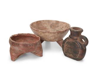 352
Pre-Columbian
A group of Latin American pottery vessels
Comprising two tripod rattle bowls, each with slits in the legs and a rattling ball, one with red and white slip accents, the other with incised cross-hatch pattern to bowl interior, and a small flask with lug handle
3 pieces
Larger bowl: 4.875" H x 9" Dia.; Flask: 6" H x 5.5" W x 2.625" D
Estimate: $200 - $400