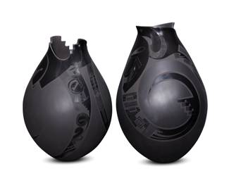 133
Lydia Quezada Celado (b. 20th century)
Two Mata Ortiz blackware pottery jars, late 20th/early 21st century; Chihuahua, Mexico
Each incised to underside: Lydia Quezada
Each with stylized rim, with black geometric motifs on a black buff ground
2 pieces
Larger: 16.5" H x 11" Dia.; Smaller: 15.5" H x 10.75" Dia.
Estimate: $800 - $1,200