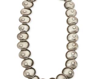 327
A Manuel Altamirano Mexican silver "Armadillo" necklace
Manuel Altamirano (b. 20th century)
Mid-20th century, Taxco, Mexico
Stamped to clasp: M Altamirano / Taxco / Mex / 925
Comprising a chunky sterling silver rounded square link necklace or small belt with concave plate links
Necklace: 27.75" L x 1.5" H
131.9 grams
Estimate: $600 - $900