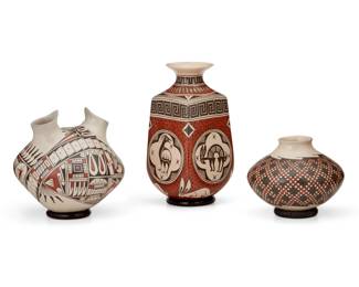 338
A group of Mata Ortiz pottery vessels
Early 21st century; Chihuahua, Mexico
Three works:
Nancy Heras de Martinez (b. 20th century)
A polychrome squared vase
Incised to underside: Nancy Heras de Martinez
The three-color vase with black and red zoomorphic motifs to body and bands of meandering and geometric motifs to shoulder, all on a cream slip glaze
9.25" H x 4.875" W x 4.875" D
Juan Mora (b. 20th century)
A polychrome low vessel
Incised to underside: Juan Mora
The three-colored vessel with black and red checkered diamond motif to body on a white slip glaze
4.875" H x 6" Dia.
Oscar Gonzalez Quezada Jr. (b. 20th century)
A polychrome two-spouted vase
Incised to underside: Oscar de G Quezada
The three-color vase with black and red feather and geometric motifs on a white slip glaze
7" H x 7" Dia.
3 pieces
Estimate: $400 - $600