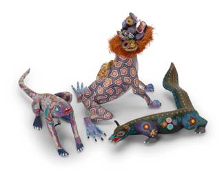 320
Late 20th/early 21st century; Oaxaca, Mexico
Three Mexican alebrijes fantastical figures
Largest signed and inscribed to underside: Jesus Ramirez / Oaxaca Mex; another signed: Pepe Santiago; last signed with lengthy inscription: Hecho Por: Jacobo Y Maria Angeles / San Martin Tilcajete Ocotlan / Oaxaca, Mexico / 2002 / [snail figure] / TAO
The vibrantly painted folk art figures carved from copal wood, each comprising anatomical traits of multiple various animal species, one with applied fibrous mane
3 pieces
Tallest: 10.375" H x 11.75" W x 9" D; Shortest: 3" H x 11" W x 10.25" D
Estimate: $300 - $500